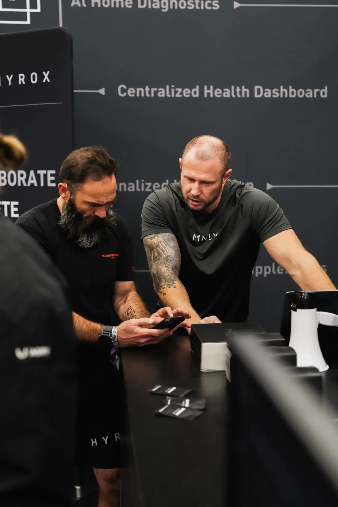 Athletes at the MNLY booth on a race weekend