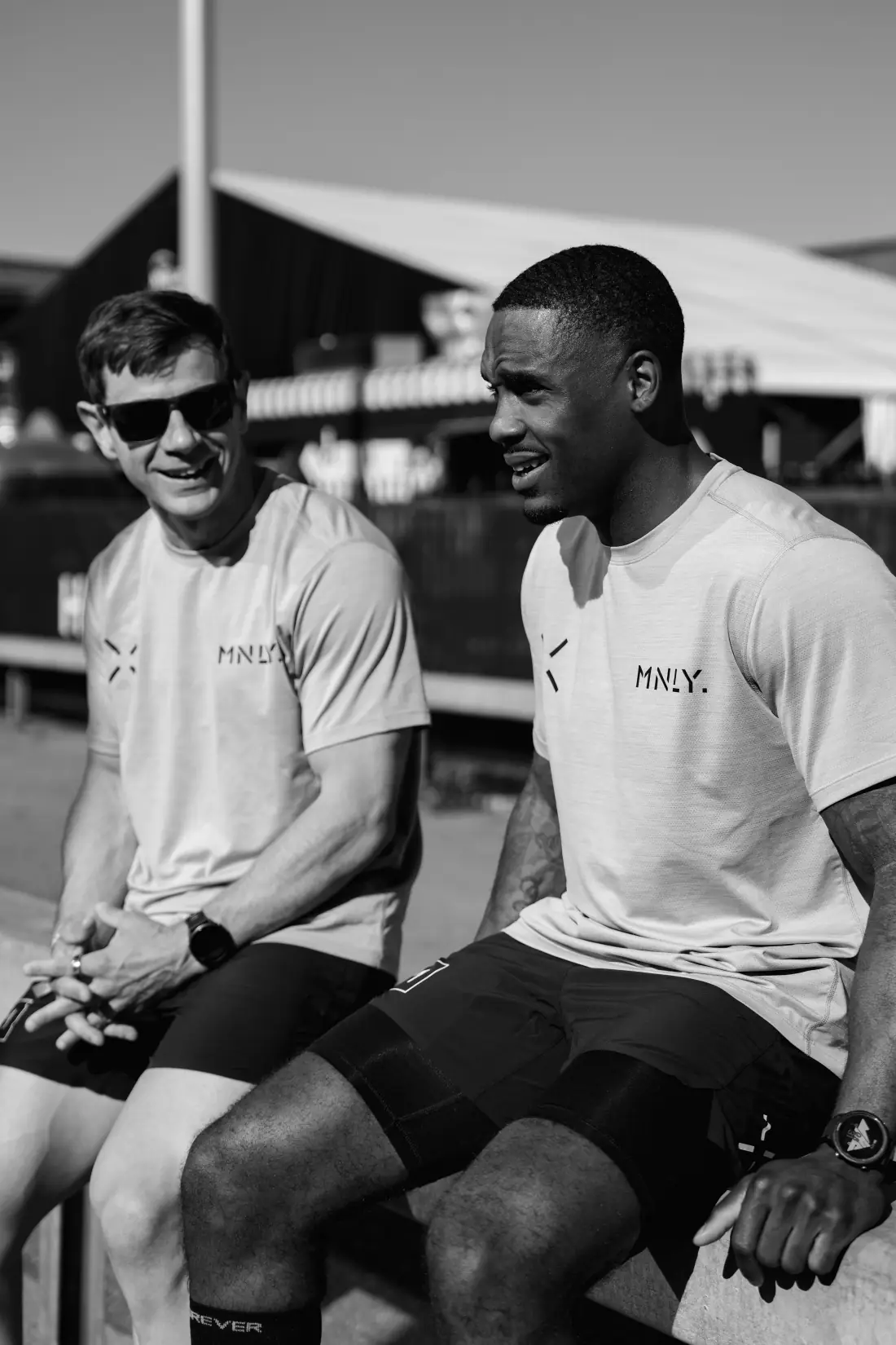Two Team MNLY athletes talking between races