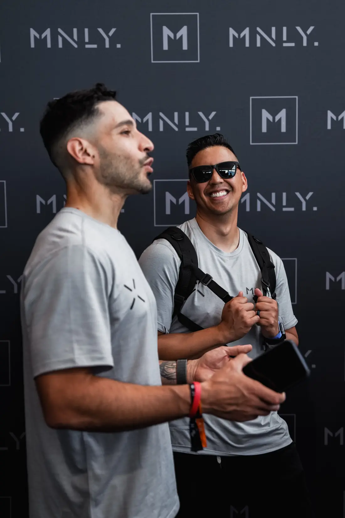 Two athletes in conversation at a MNLY event